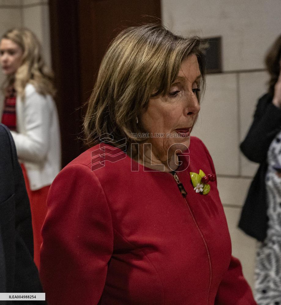 Former House Speaker Nancy Pelosi walks out  after  the  classified briefing