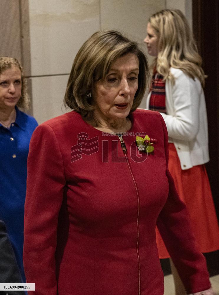 Former House Speaker Nancy Pelosi walks out  after  the  classified briefing