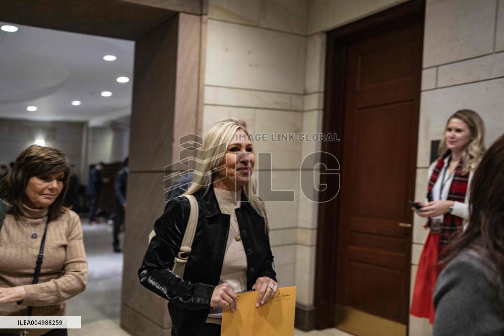 Representative Marjorie Taylor Greene walks out  after  the  classified briefing