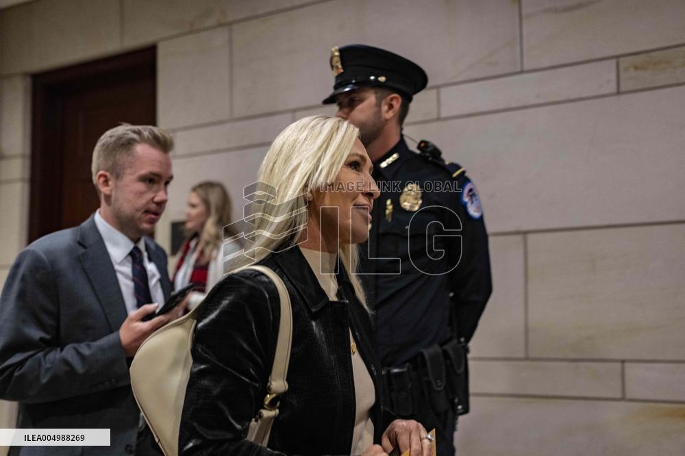 Representative Marjorie Taylor Greene walks out  after  the  classified briefing