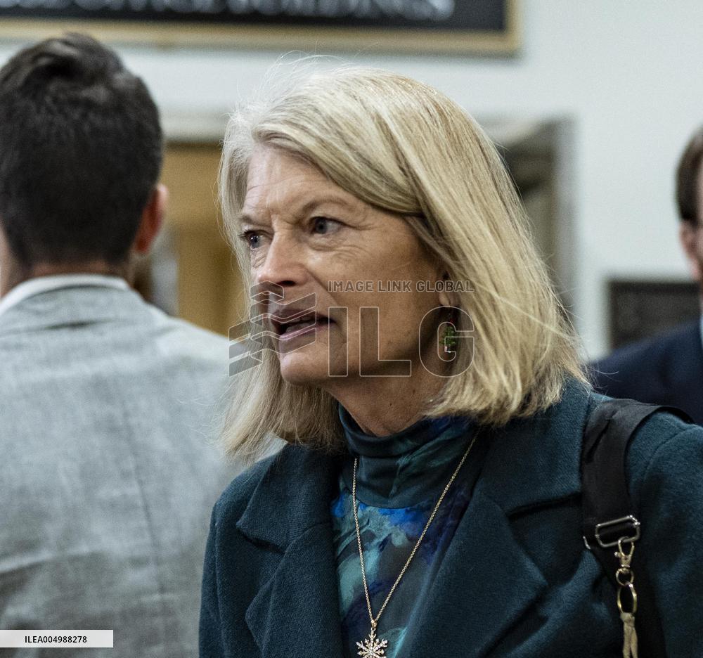 United States Senator  Lisa Murkowski walks out  after  the  classified briefing