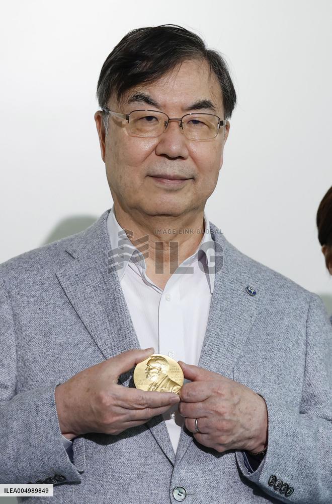 Nobel laureate Sakaguchi returns to Japan