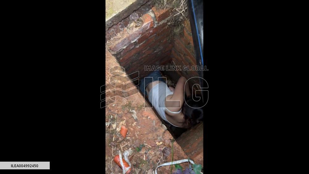 China: Student Climbs Into Campus Sewer to Rescue Trapped Dog in Hunan