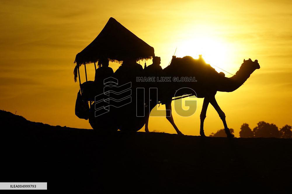 Tourists Enjoy a Camel Safari - India