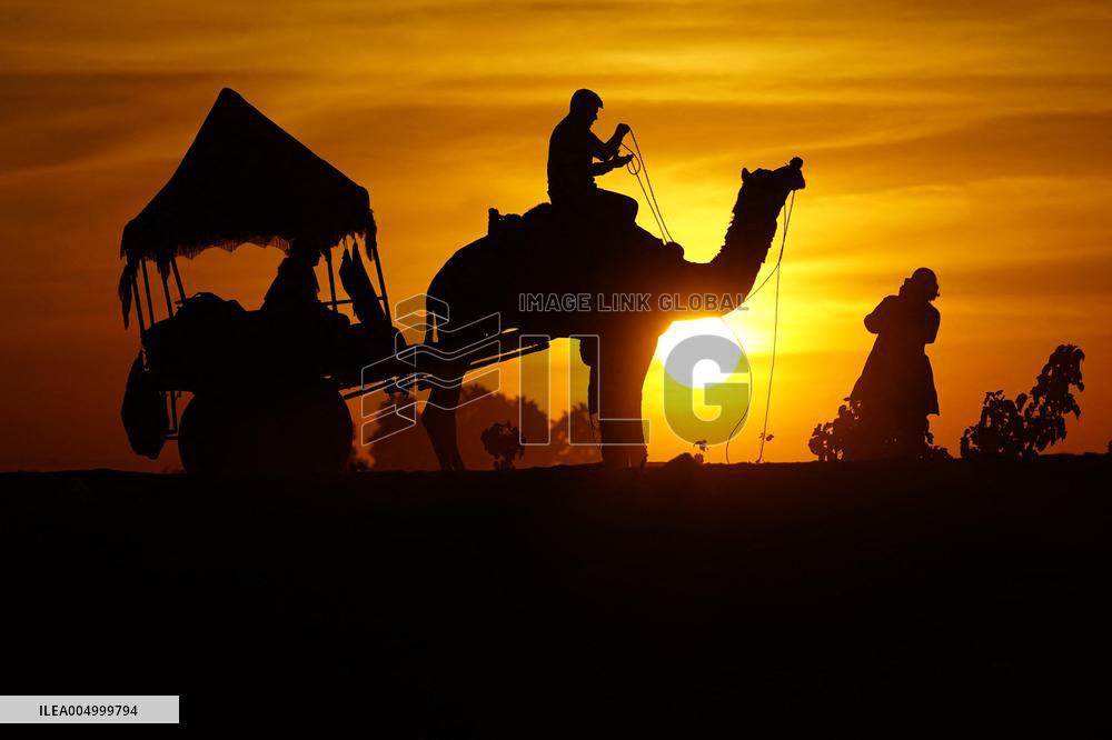 Tourists Enjoy a Camel Safari - India