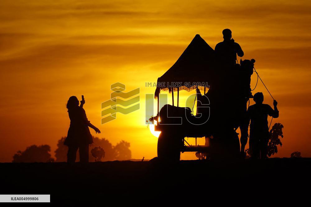 Tourists Enjoy a Camel Safari - India