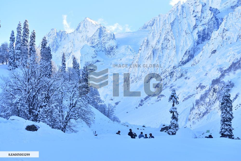 People Enjoy The Season's First Snowfall In Kashmir