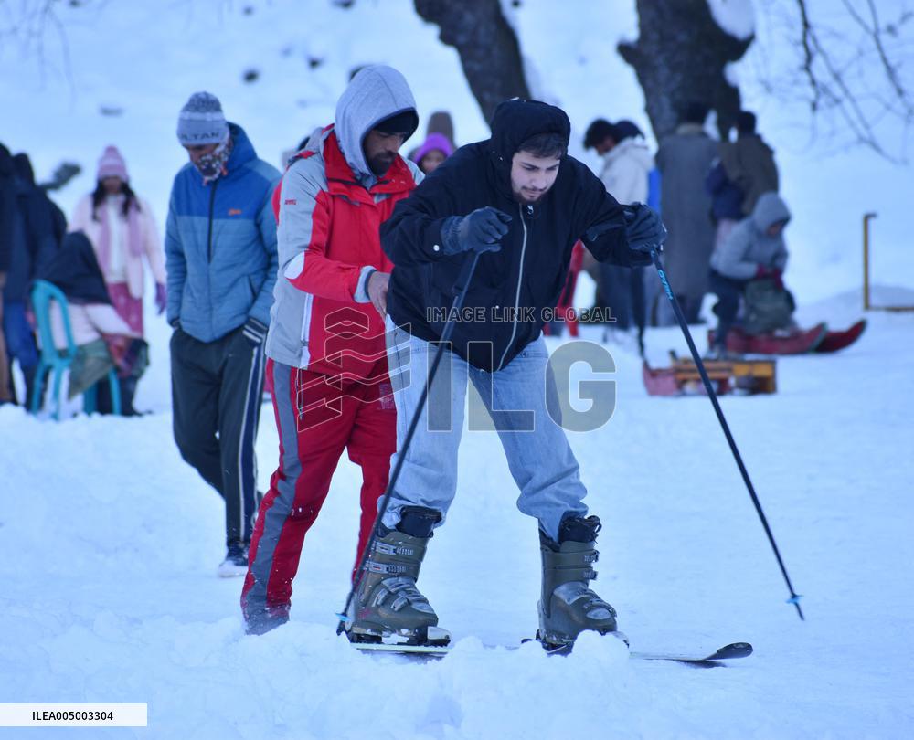 People Enjoy The Season's First Snowfall In Kashmir