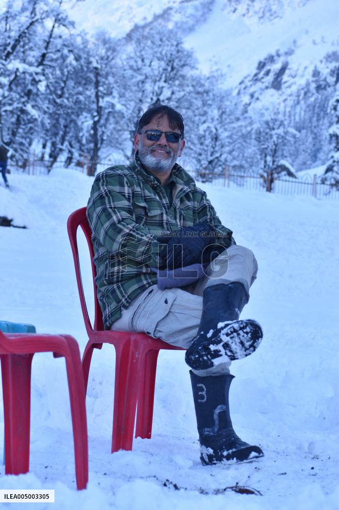 People Enjoy The Season's First Snowfall In Kashmir