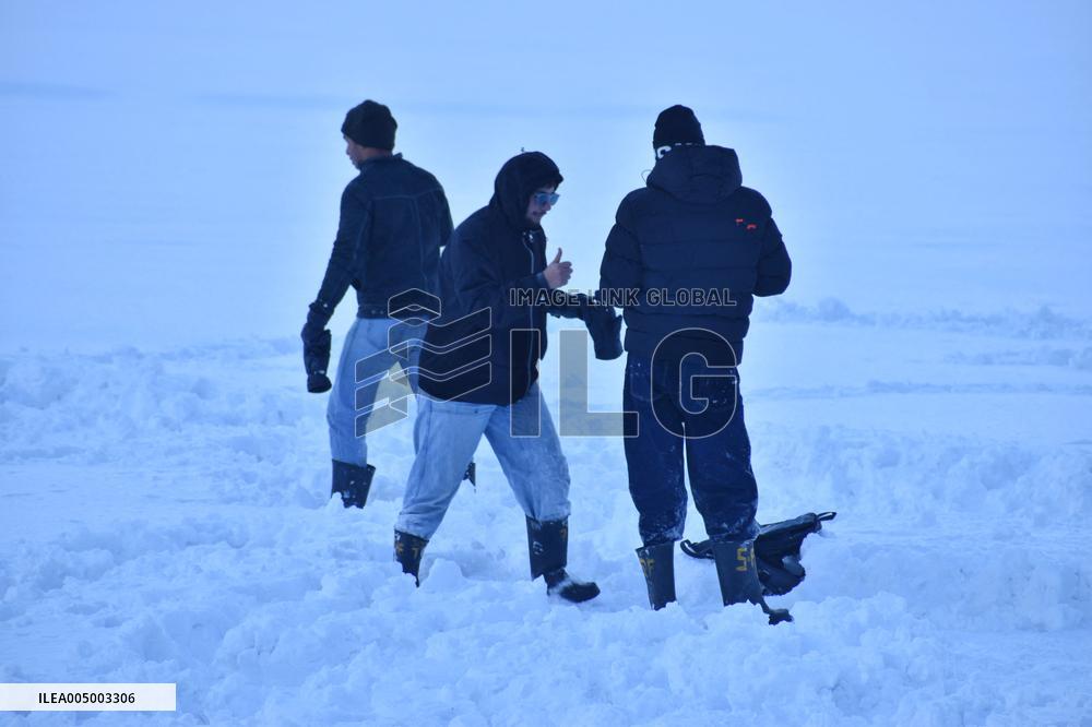 People Enjoy The Season's First Snowfall In Kashmir