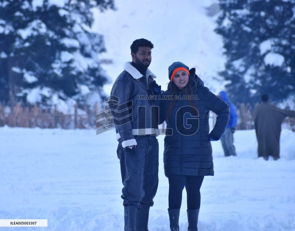 People Enjoy The Season's First Snowfall In Kashmir