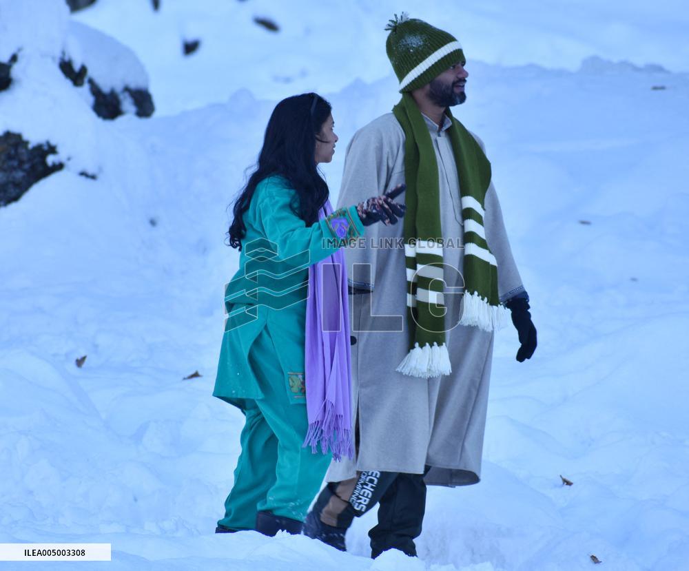 People Enjoy The Season's First Snowfall In Kashmir