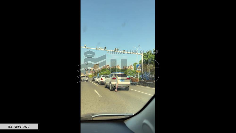 China: Driver Tows Giant Fish Through City Street