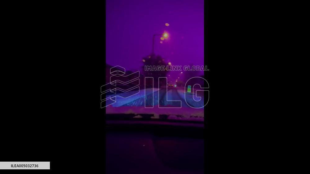 UK: Pink Sky Baffles Residents in Birmingham During Winter Storm