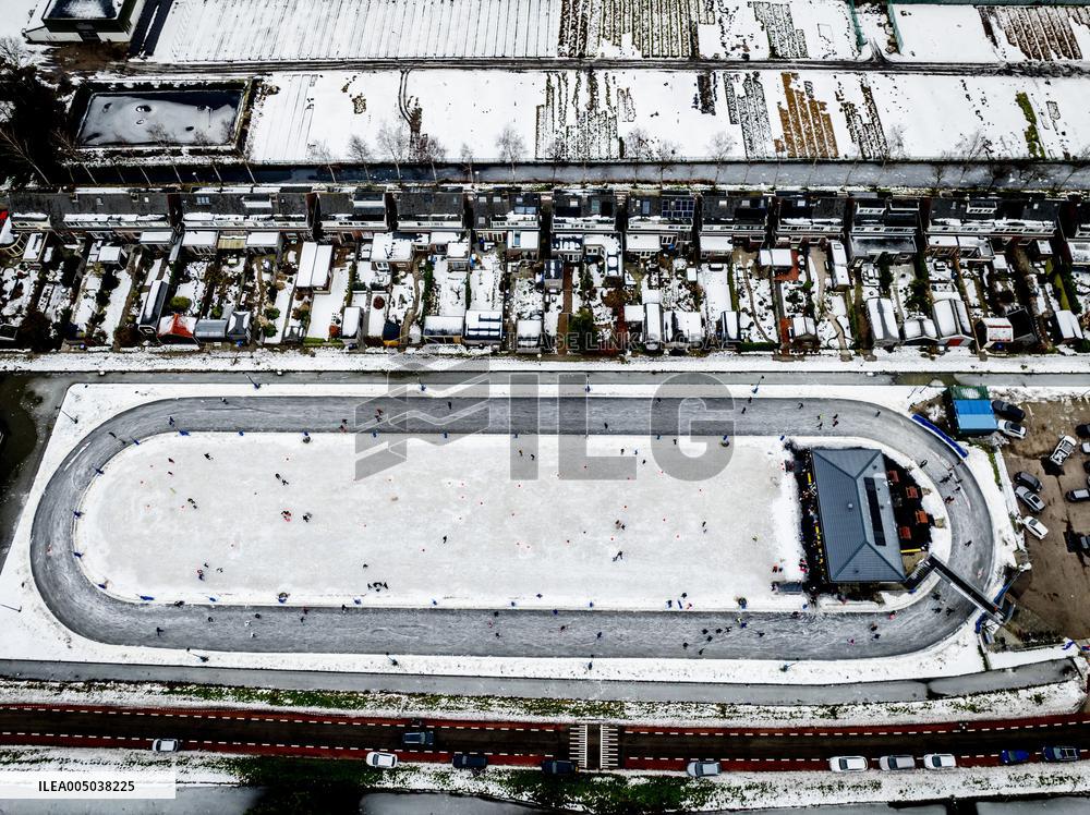 People Skate on Natural Ice Rink in Boskoop - Netherlands