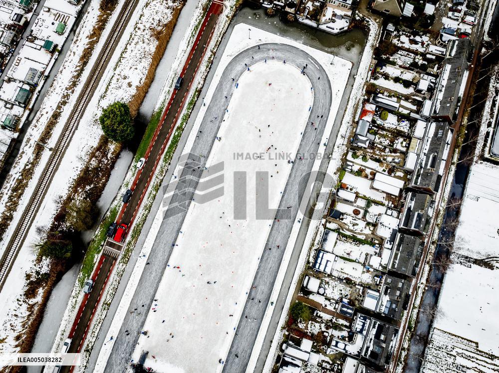 People Skate on Natural Ice Rink in Boskoop - Netherlands