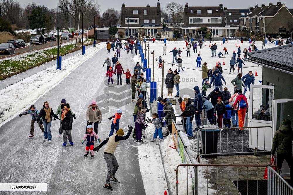 People Skate on Natural Ice Rink in Boskoop - Netherlands