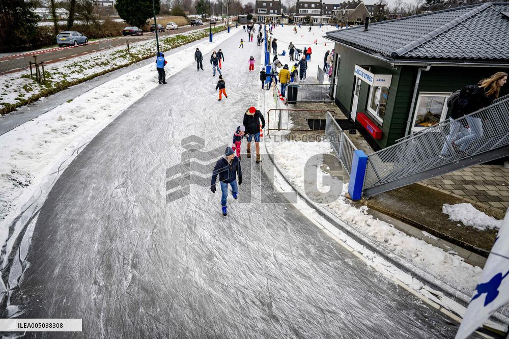 People Skate on Natural Ice Rink in Boskoop - Netherlands