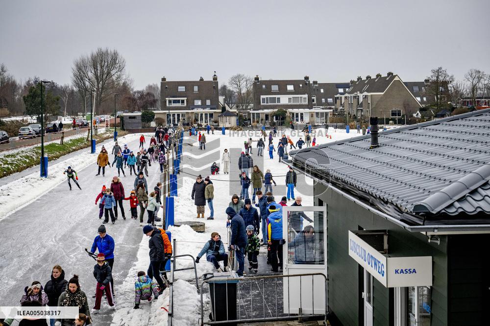 People Skate on Natural Ice Rink in Boskoop - Netherlands