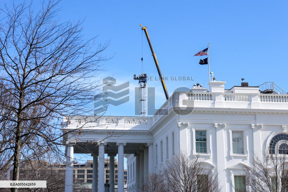 A tower crane is built in the White House Ballroom construction zone where the East wing previously stood at the White House
