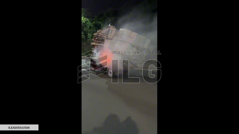 China: Cigarette Sparks Fire on Tricycle Cargo