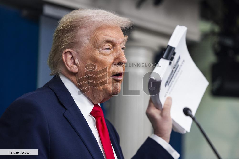 US President Trump speaks on to reporters ahead of trip to Davos