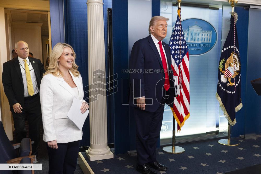 US President Trump speaks on to reporters ahead of trip to Davos