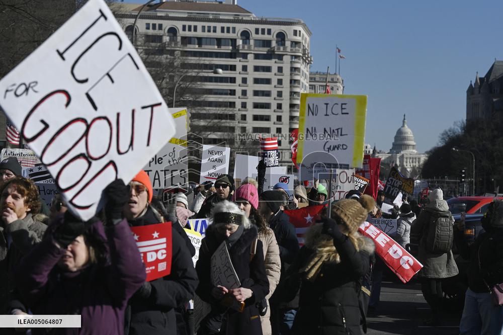 People protest on the first anniversary of President Donald Trump's second term in office