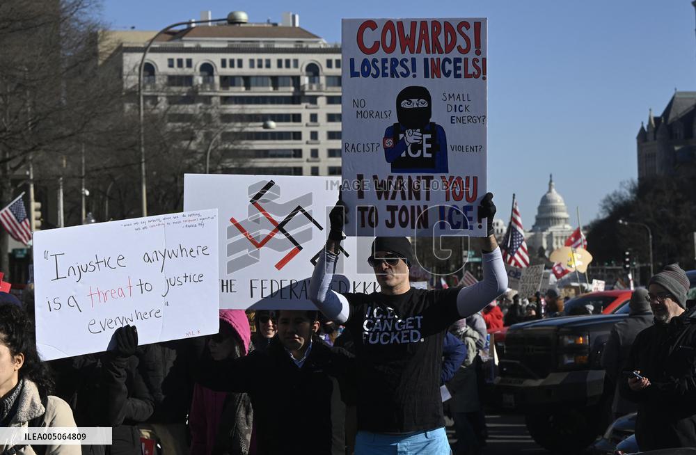 People protest on the first anniversary of President Donald Trump's second term in office