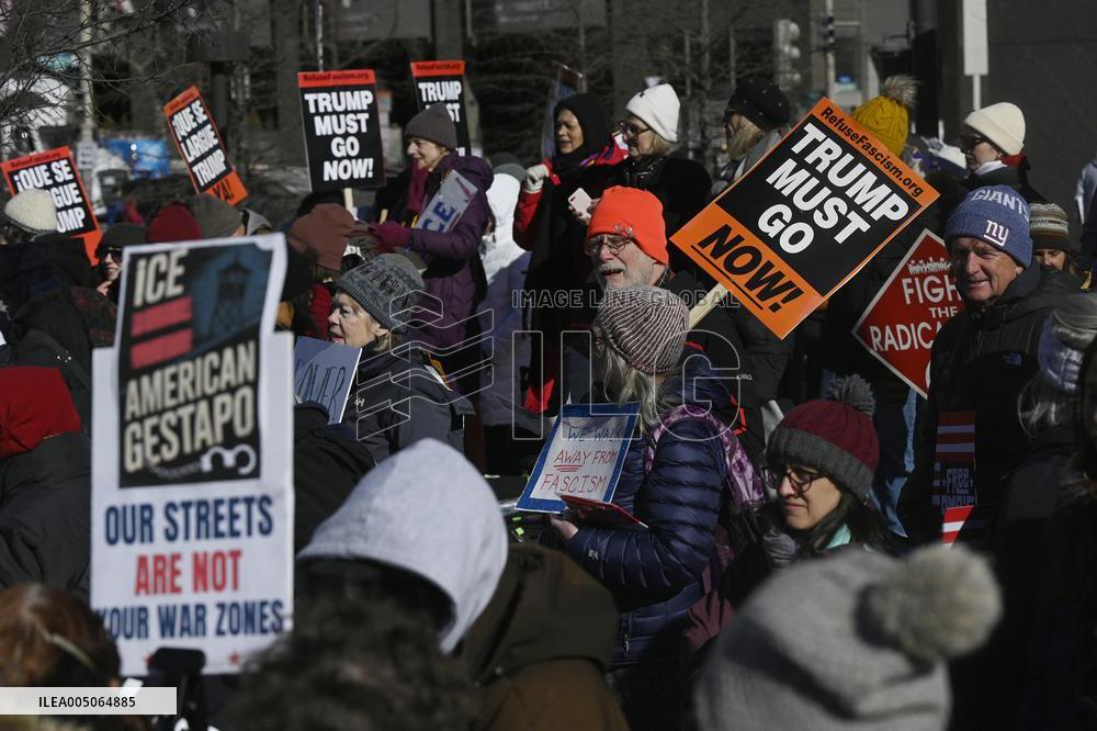 People protest on the first anniversary of President Donald Trump's second term in office