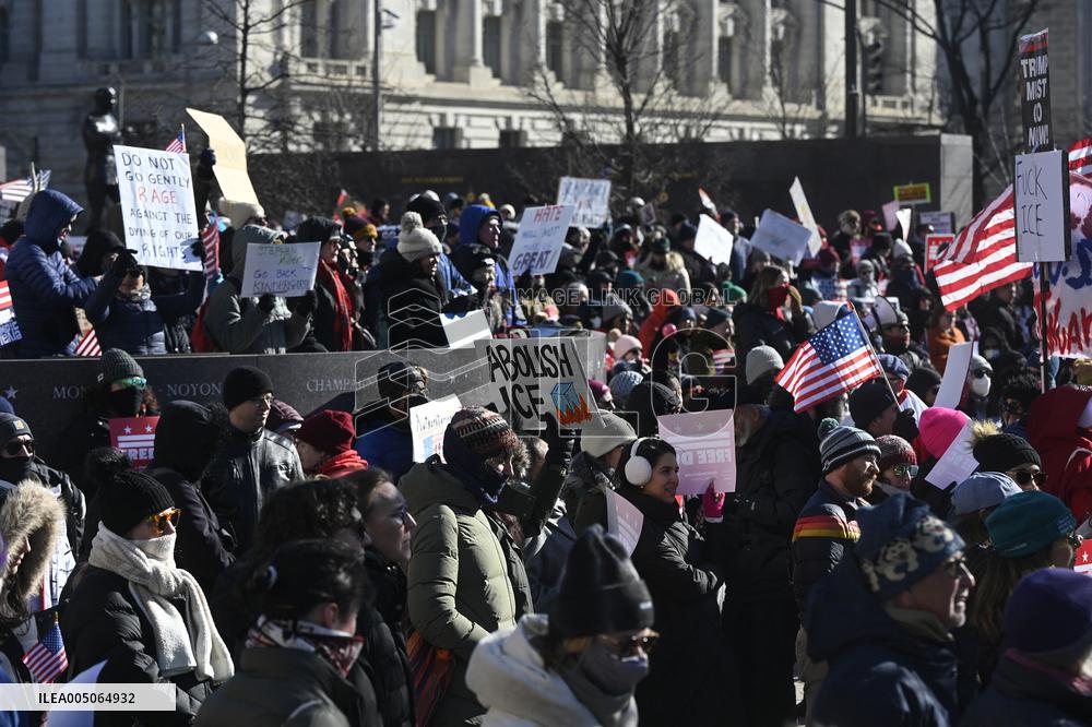 People protest on the first anniversary of President Donald Trump's second term in office