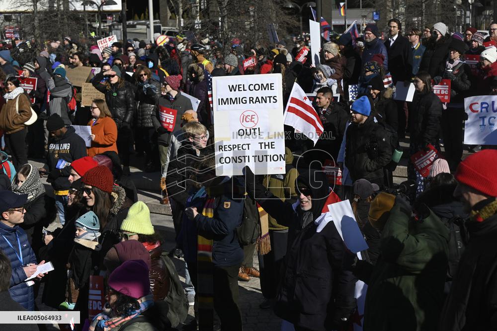 People protest on the first anniversary of President Donald Trump's second term in office