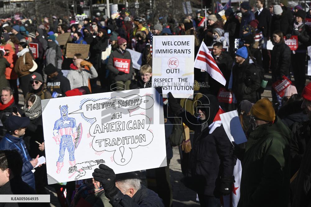 People protest on the first anniversary of President Donald Trump's second term in office