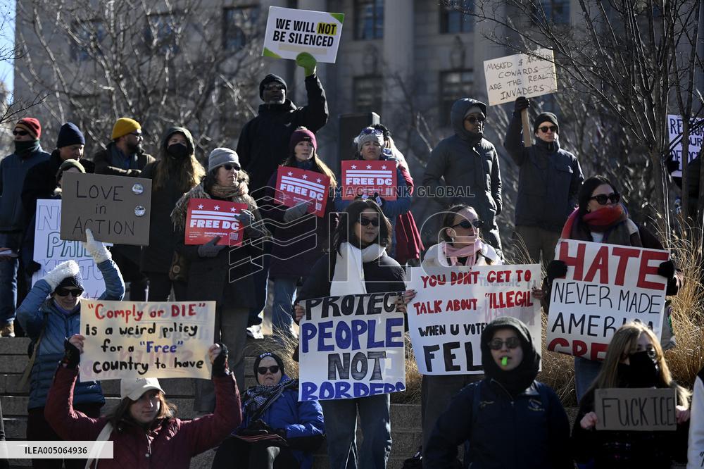 People protest on the first anniversary of President Donald Trump's second term in office