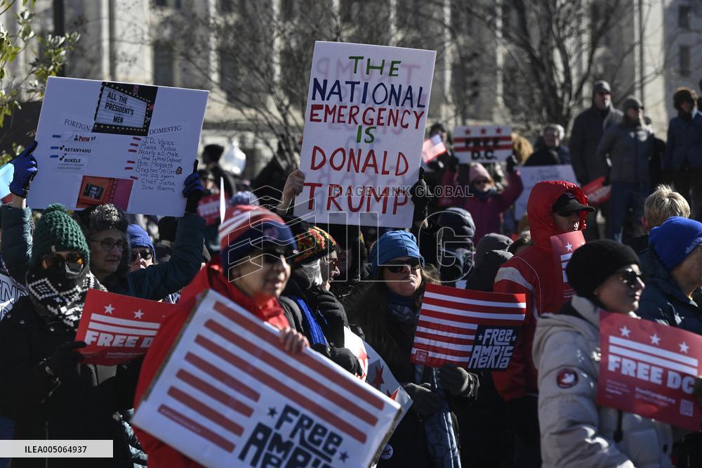 People protest on the first anniversary of President Donald Trump's second term in office