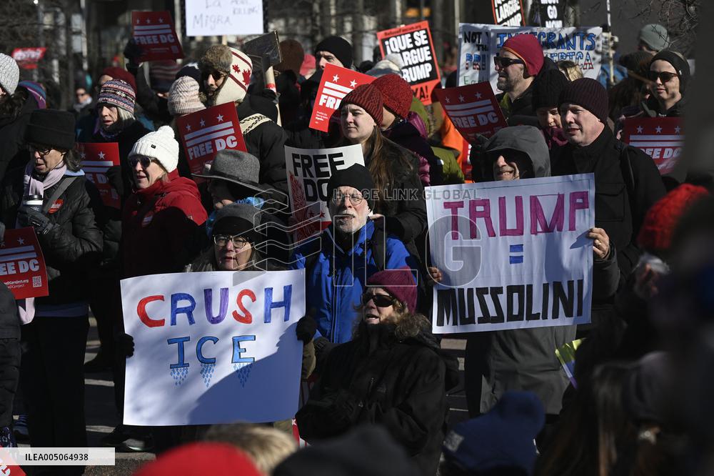 People protest on the first anniversary of President Donald Trump's second term in office