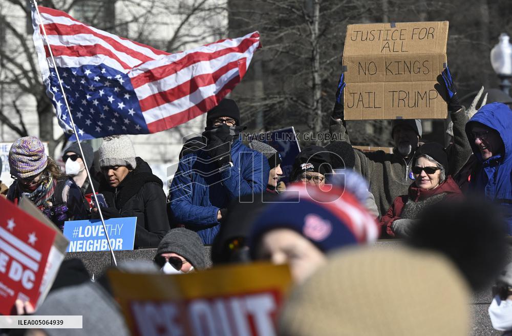 People protest on the first anniversary of President Donald Trump's second term in office
