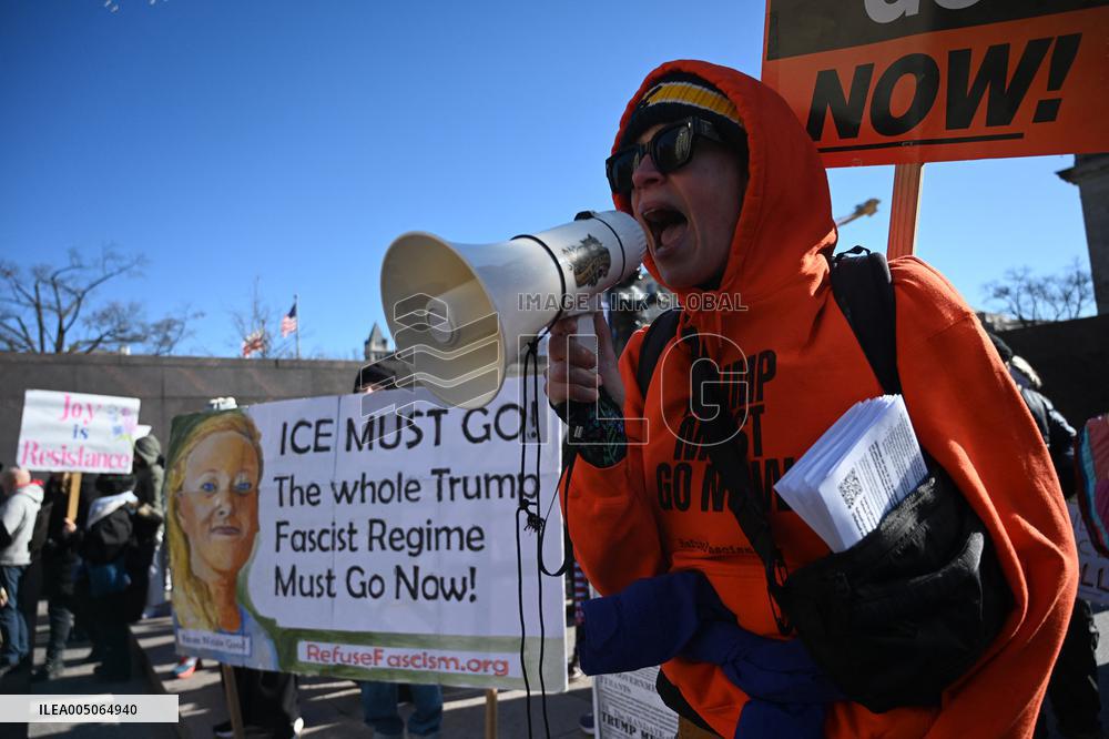 People protest on the first anniversary of President Donald Trump's second term in office
