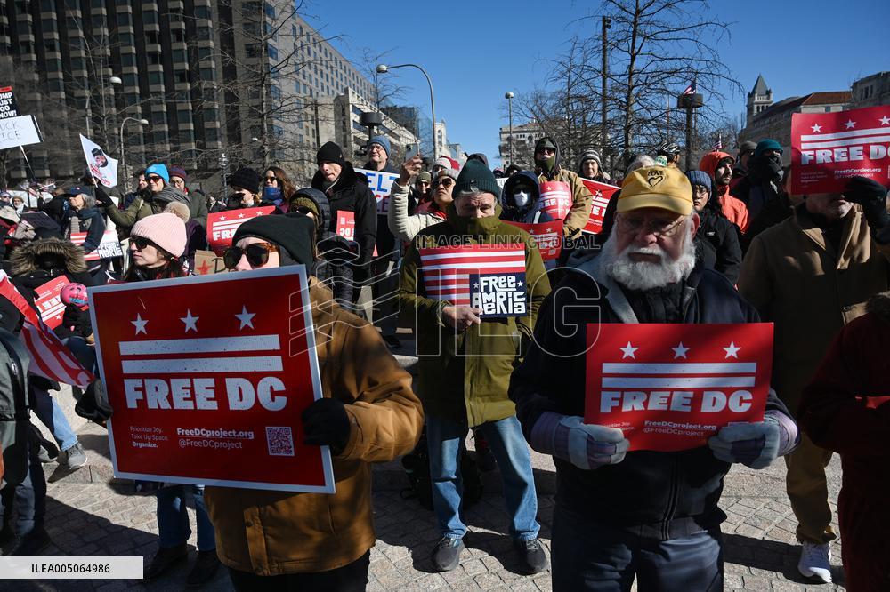 People protest on the first anniversary of President Donald Trump's second term in office