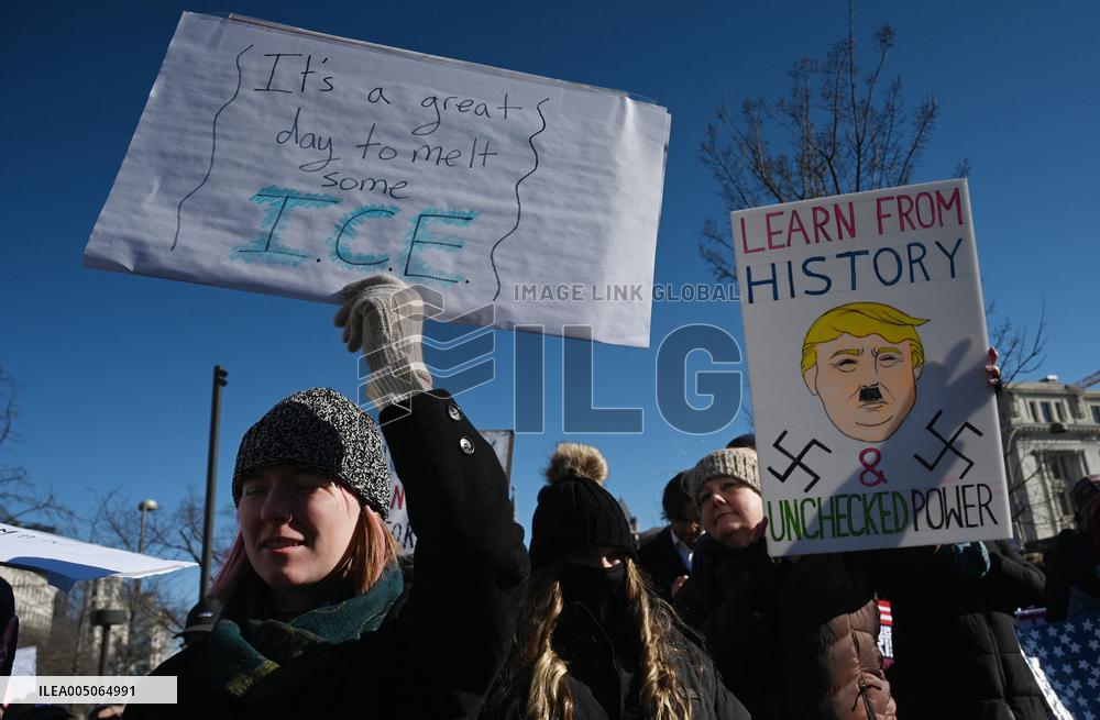 People protest on the first anniversary of President Donald Trump's second term in office