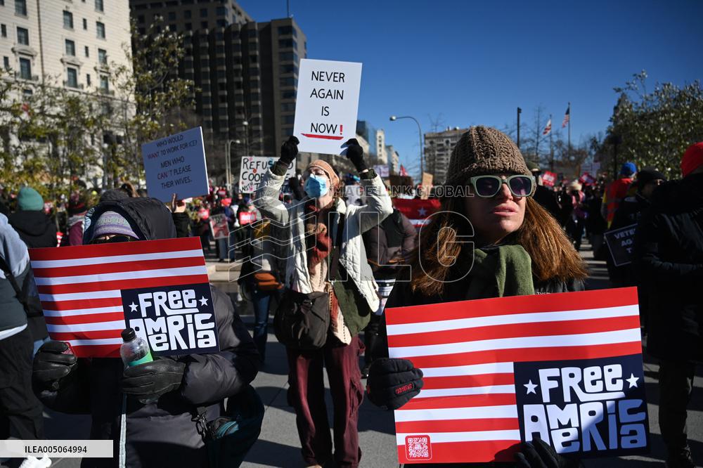 People protest on the first anniversary of President Donald Trump's second term in office