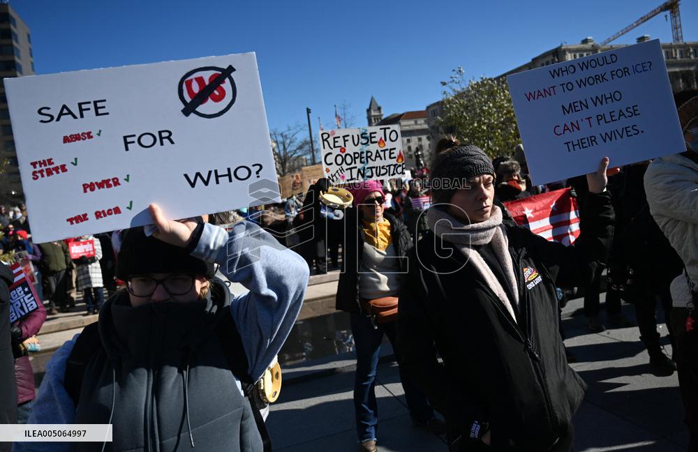 People protest on the first anniversary of President Donald Trump's second term in office