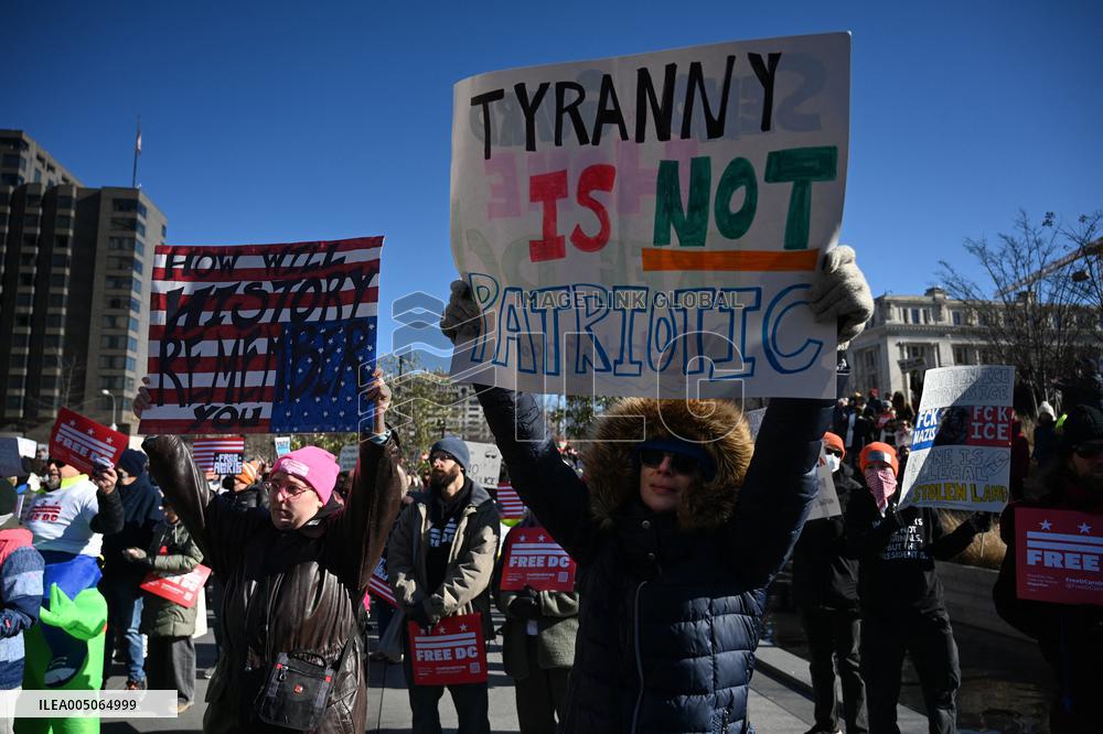 People protest on the first anniversary of President Donald Trump's second term in office