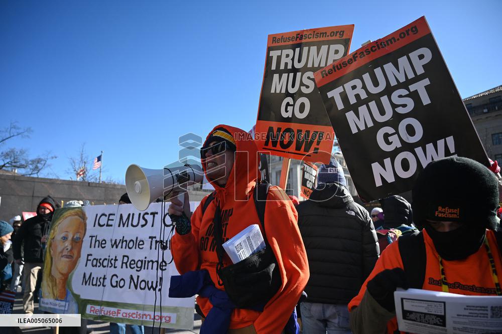 People protest on the first anniversary of President Donald Trump's second term in office