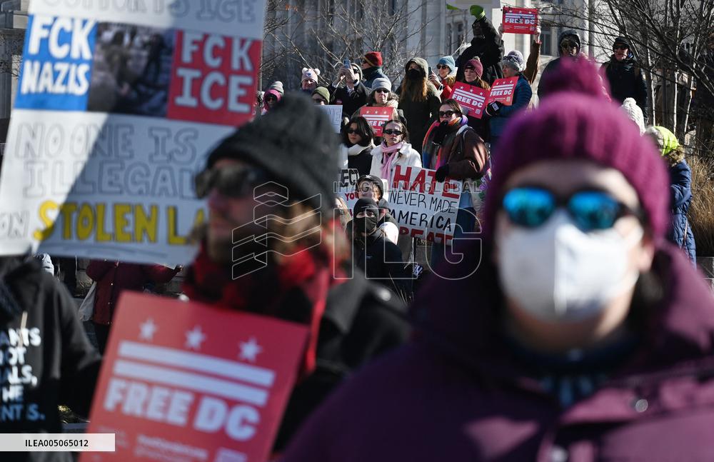 People protest on the first anniversary of President Donald Trump's second term in office