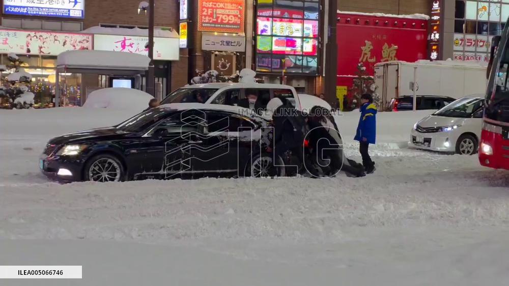 Japan: Record Snowfall Leaves Cars Stuck in Downtown Sapporo