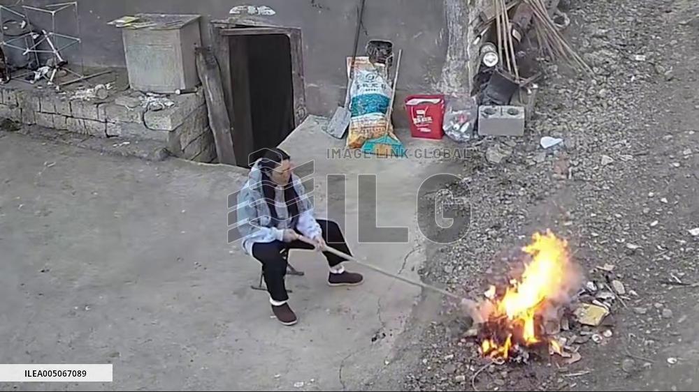 China: Woman Narrowly Escapes Injury After Trash Fire Explodes in Yunnan