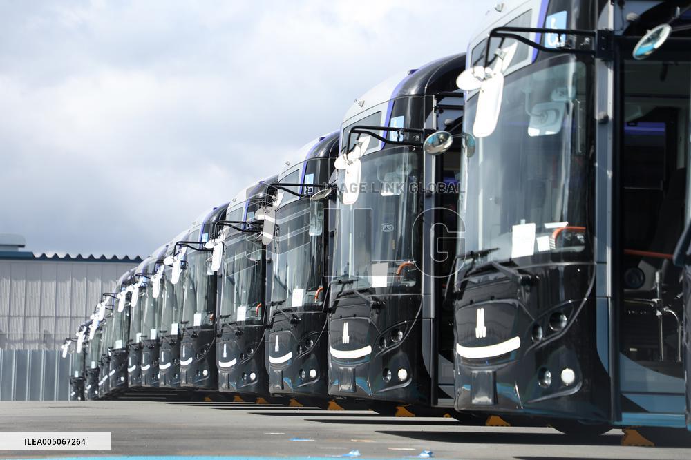Approximately 150 EV buses gathered at a vast site in Morinomiya, Osaka.