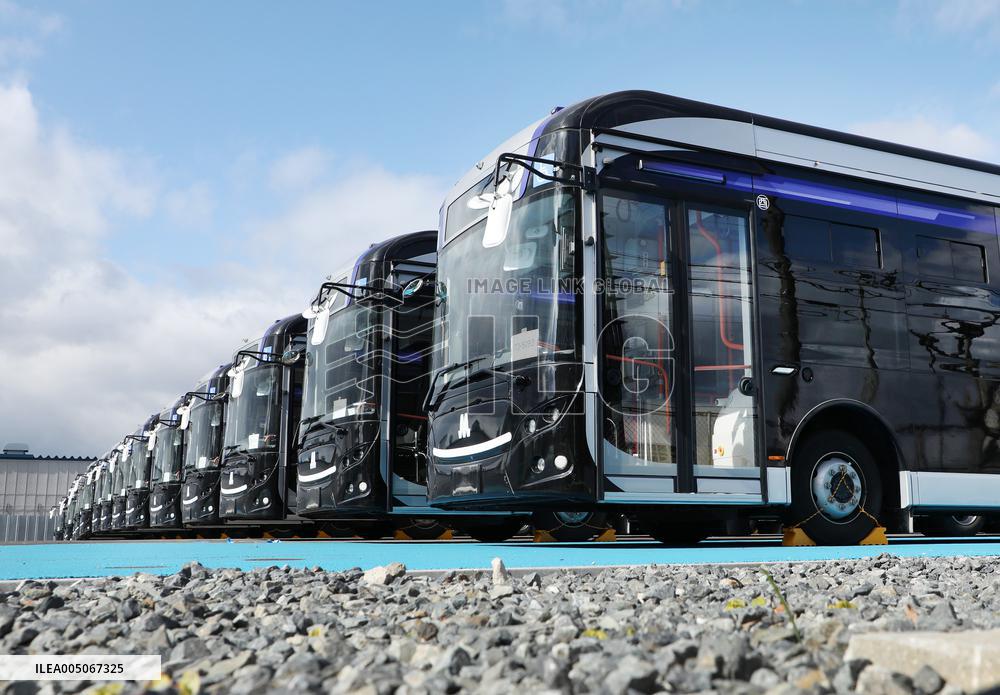 Approximately 150 EV buses gathered at a vast site in Morinomiya, Osaka.