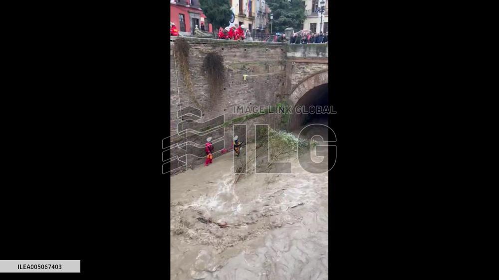 Spain: Firefighters Clear Storm Leonardo Debris from Fast-Moving Granada River